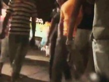 A hot brunette lady n the shortest pants ever smoking a cig