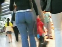 Hot brunette w/ a nice ass in a voyur porno pacing in a shopping mall