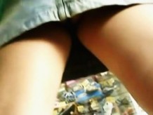 Upskirt voyeur gets between the legs of a  babe