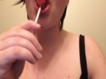 Masturbating while sucking on a sucker