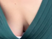 Friendly Asian gal keeps smiling while her cleavage is totally revealed