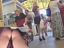 Legs and smooth butt upskirt at the market