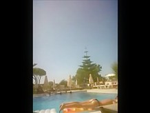 Topless girl in pool