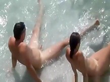 Nudist couple in the water